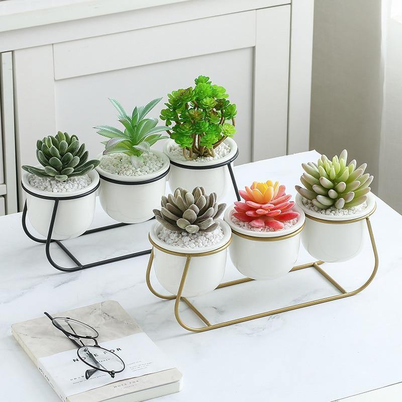 Three White Ceramic Pots on a Metal Stand