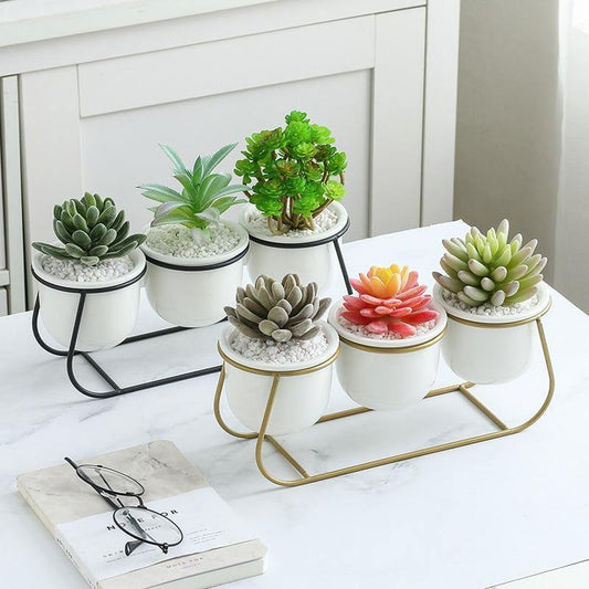 Three White Ceramic Pots on a Metal Stand
